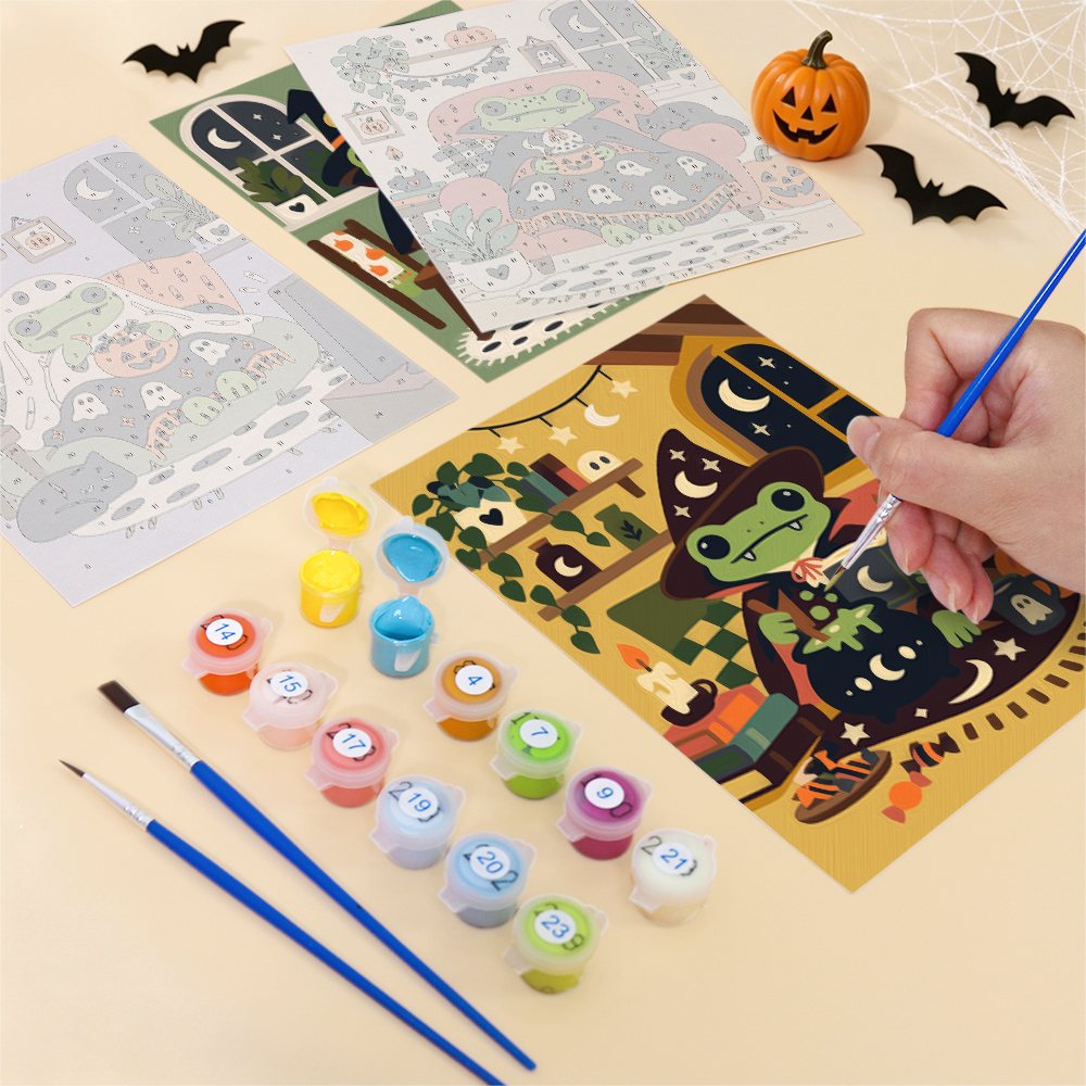 Filling in a Cozy Frog Halloween mini canvas with numbered acrylic paints and a fine brush