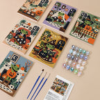Cozy Frog Halloween mini paint by numbers kit with six numbered canvases, acrylic paints, brushes and layout