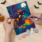 Numbered paint pots and brushes on a pre-stretched Cozy Haunted Home mini canvas