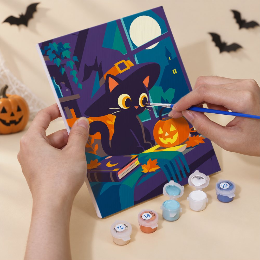 Numbered paint pots and brushes on a pre-stretched Cozy Haunted Home mini canvas