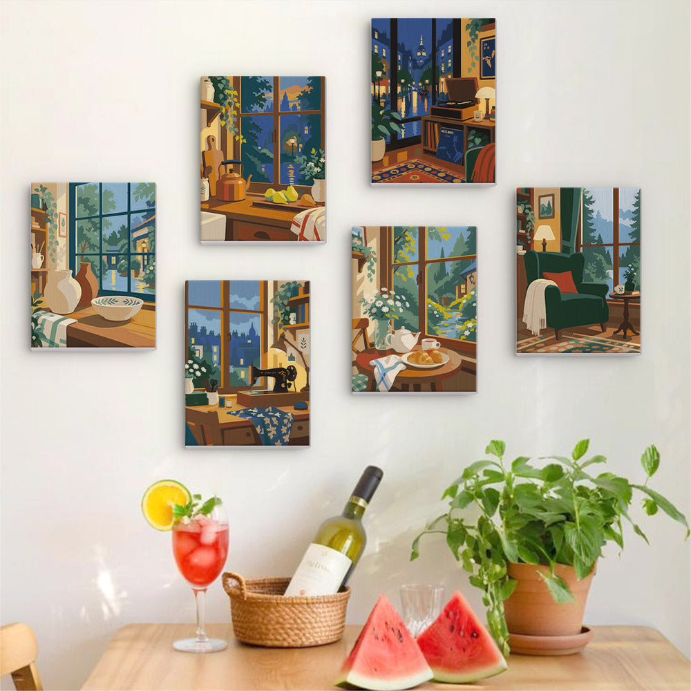 Six finished Cozy Nooks mini paintings hung on a wall above a table