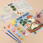 Filling in a Cozy Reading Nook mini canvas with numbered acrylic paints and a fine brush