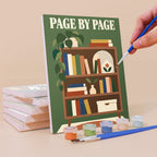 Painting a Cozy Reading Nook mini canvas propped up beside numbered acrylic paints