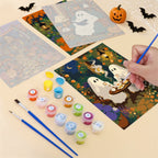 Filling in a Cozy Witch Cottage mini canvas with numbered acrylic paints and a fine brush