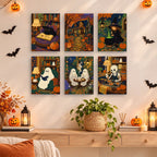 Cozy Witch Cottage mini paintings displayed as a gallery wall in a sunny kitchen