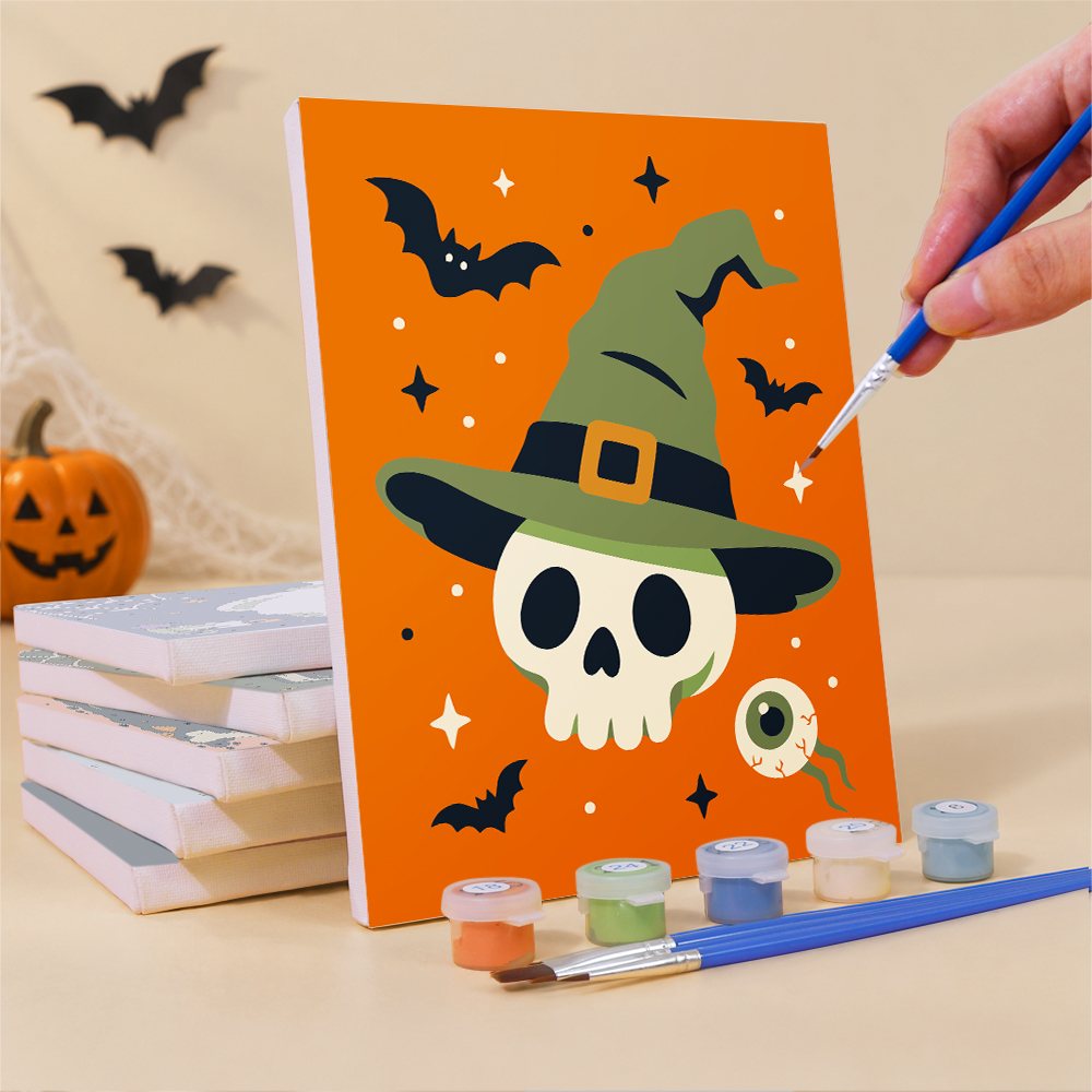 Painting a Creepy Classics mini canvas propped up beside numbered acrylic paints