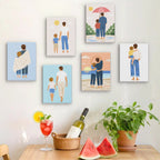 Six finished Dad and Me mini paintings hung on a wall above a table