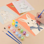 Filling in a Dapper Bunnies mini canvas with numbered acrylic paints and a fine brush