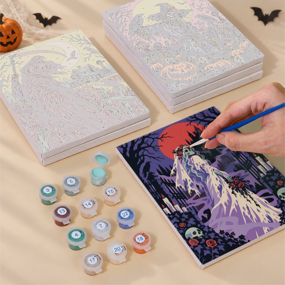 Painting one of the Dark Harvest Folk Art designs next to a stack of mini canvases