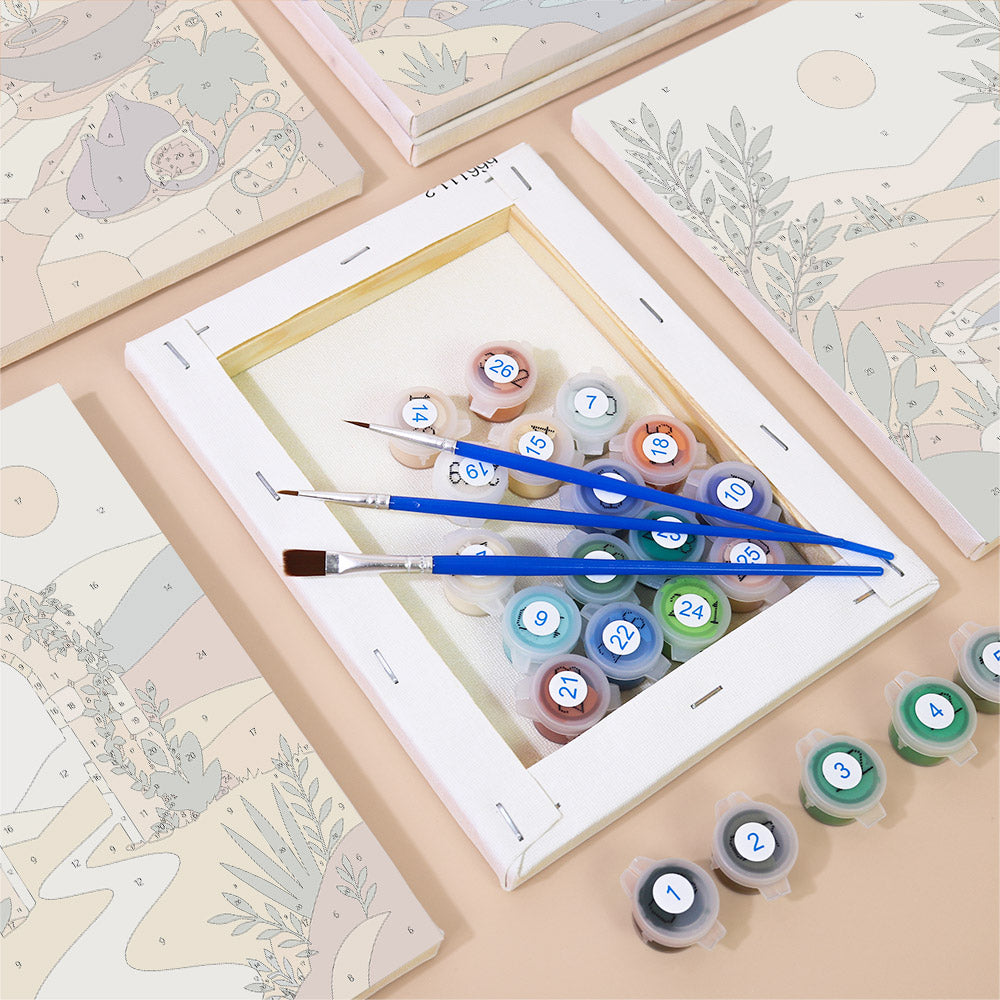 Numbered paint pots and brushes on a pre-stretched Desert Light mini canvas