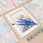 Numbered paint pots and brushes on a pre-stretched Dogs at Home mini canvas