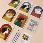 Dogs in Sweaters mini paint by numbers kit with six numbered canvases, acrylic paints, brushes and layout