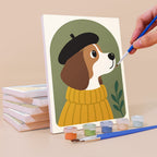 Painting a Dogs in Sweaters mini canvas propped up beside numbered acrylic paints