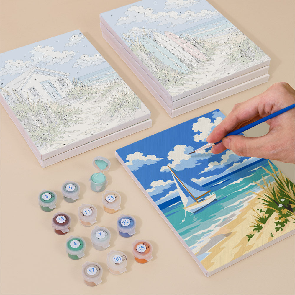 Painting one of the Dune Paths designs next to a stack of mini canvases