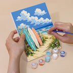 Hand holding a Dune Paths mini canvas while painting the details
