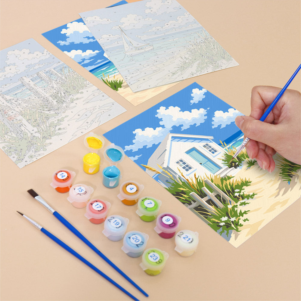 Filling in a Dune Paths mini canvas with numbered acrylic paints and a fine brush