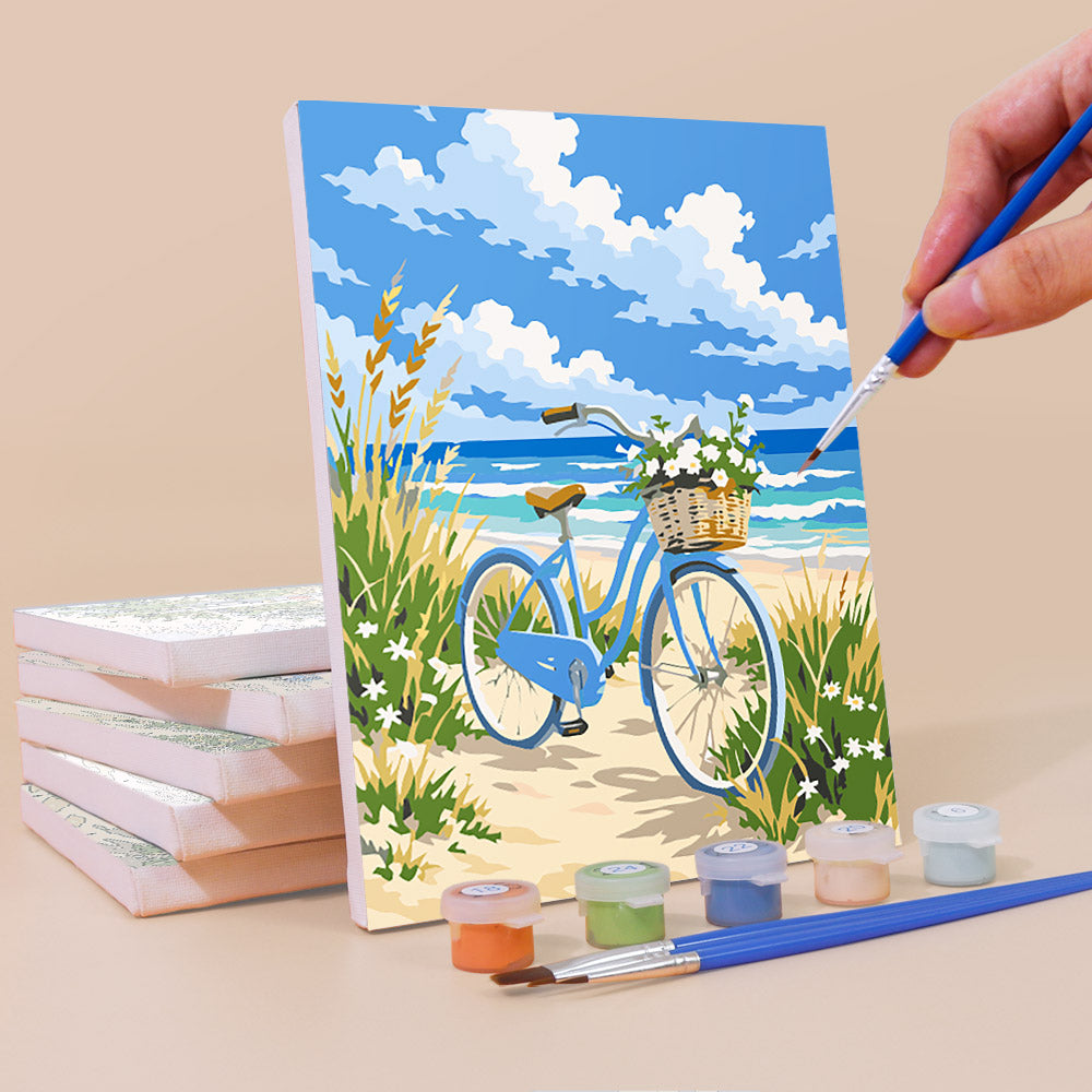 Painting a Dune Paths mini canvas propped up beside numbered acrylic paints