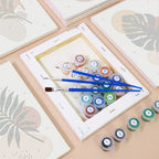 Numbered paint pots and brushes on a pre-stretched Earthy Leaves mini canvas