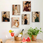 Six finished Evening Elegance mini paintings hung on a wall above a table