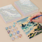 Painting one of the Evergreen Coast designs next to a stack of mini canvases
