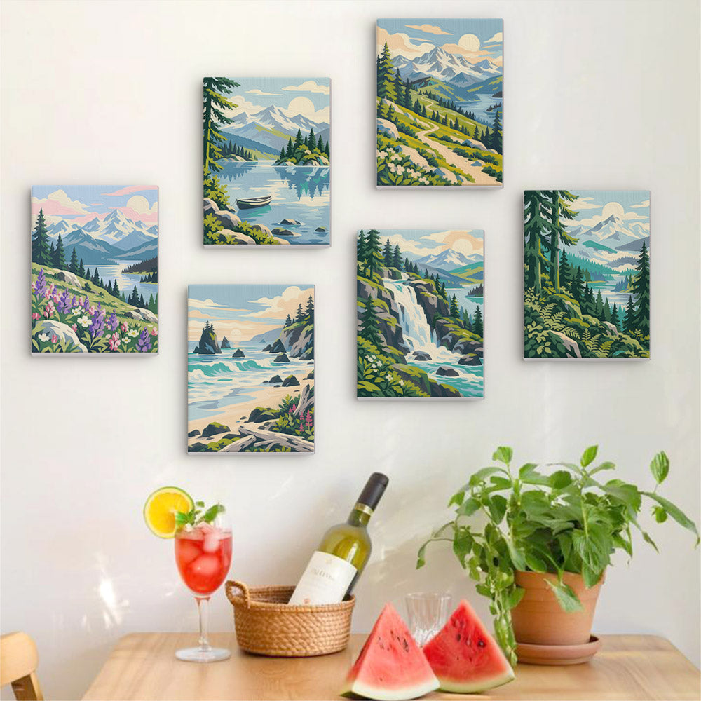 Six finished Evergreen Coast mini paintings hung on a wall above a table