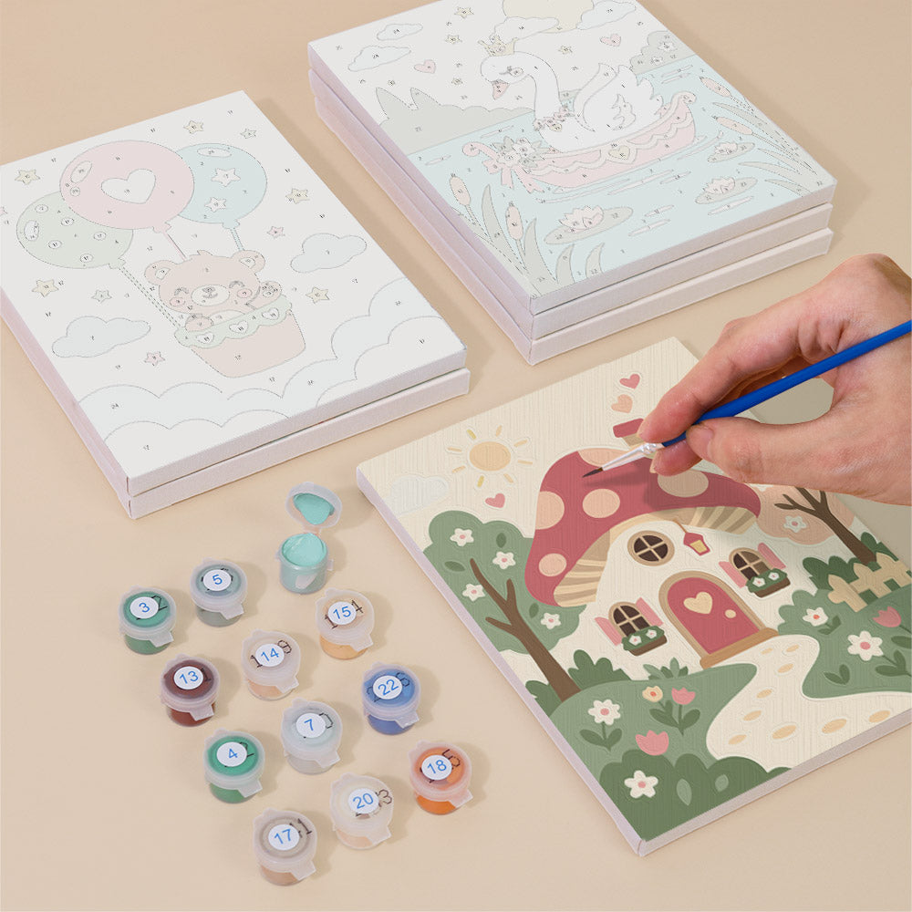 Painting one of the Fairytale Dreams designs next to a stack of mini canvases