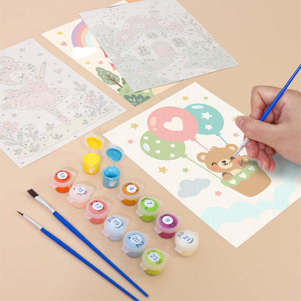 Filling in a Fairytale Dreams mini canvas with numbered acrylic paints and a fine brush