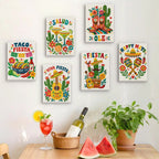 Six finished Fiesta Time mini paintings hung on a wall above a table