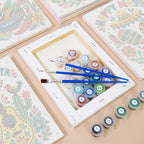 Numbered paint pots and brushes on a pre-stretched Fiesta Time mini canvas