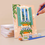 Painting a Flower Box Windows mini canvas propped up beside numbered acrylic paints