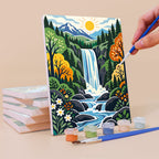 Painting a Folk Art Landscapes mini canvas propped up beside numbered acrylic paints