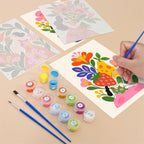 Filling in a Folk Blossoms mini canvas with numbered acrylic paints and a fine brush
