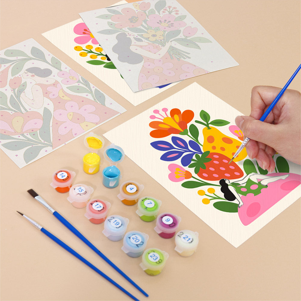 Filling in a Folk Blossoms mini canvas with numbered acrylic paints and a fine brush