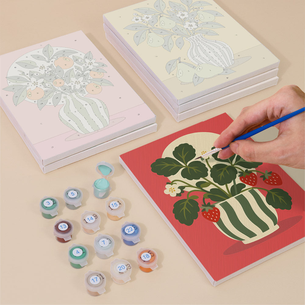 Painting one of the Fruit & Flower Jugs designs next to a stack of mini canvases