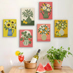 Six finished Fruit & Flower Jugs mini paintings hung on a wall above a table