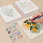 Painting one of the Fruit Branches designs next to a stack of mini canvases