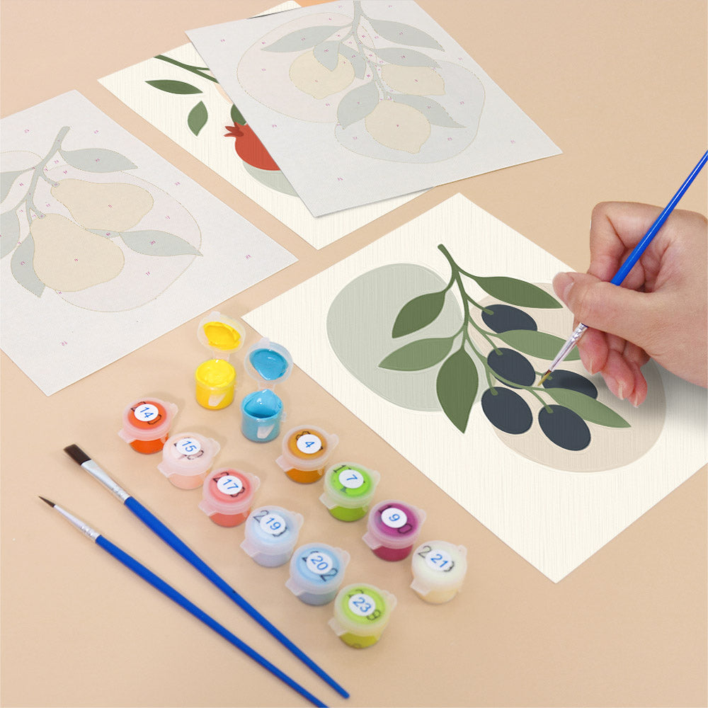 Filling in a Fruit Branches mini canvas with numbered acrylic paints and a fine brush