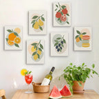 Six finished Fruit Branches mini paintings hung on a wall above a table