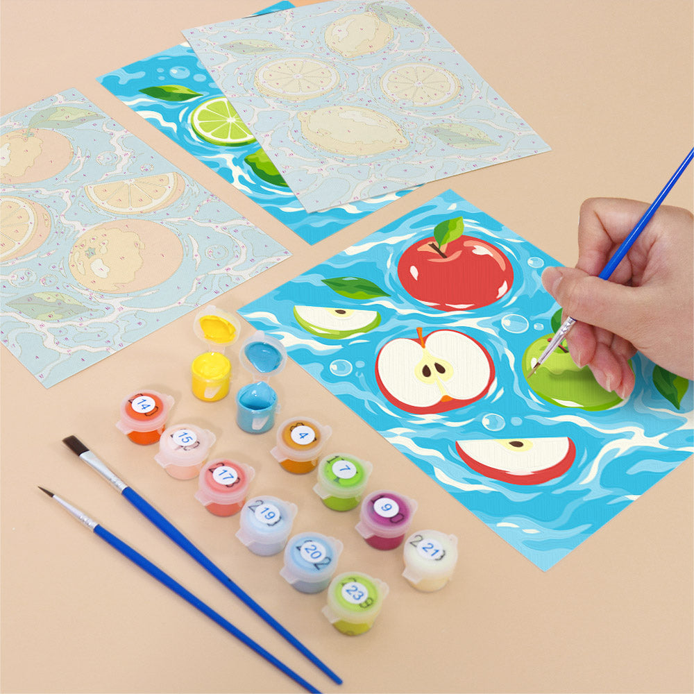 Filling in a Fruit Splash mini canvas with numbered acrylic paints and a fine brush