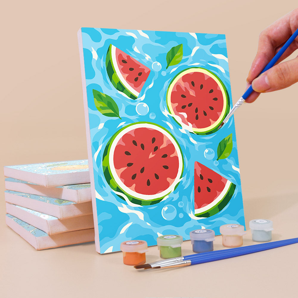 Painting a Fruit Splash mini canvas propped up beside numbered acrylic paints