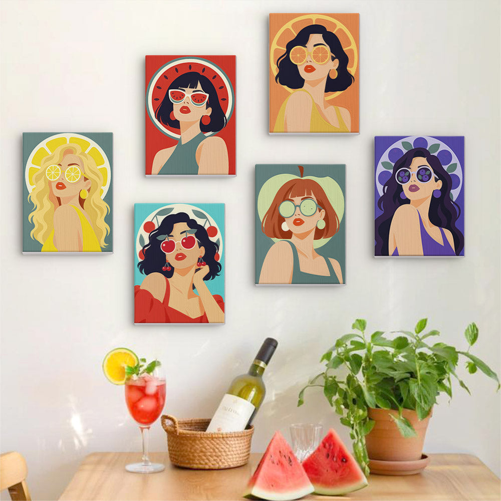 Six finished Fruity Shades mini paintings hung on a wall above a table