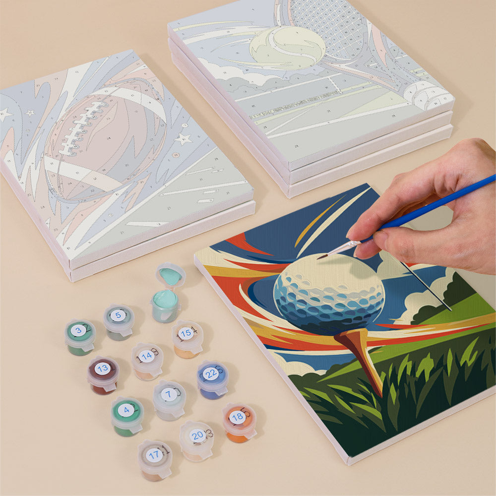 Painting one of the Game On designs next to a stack of mini canvases