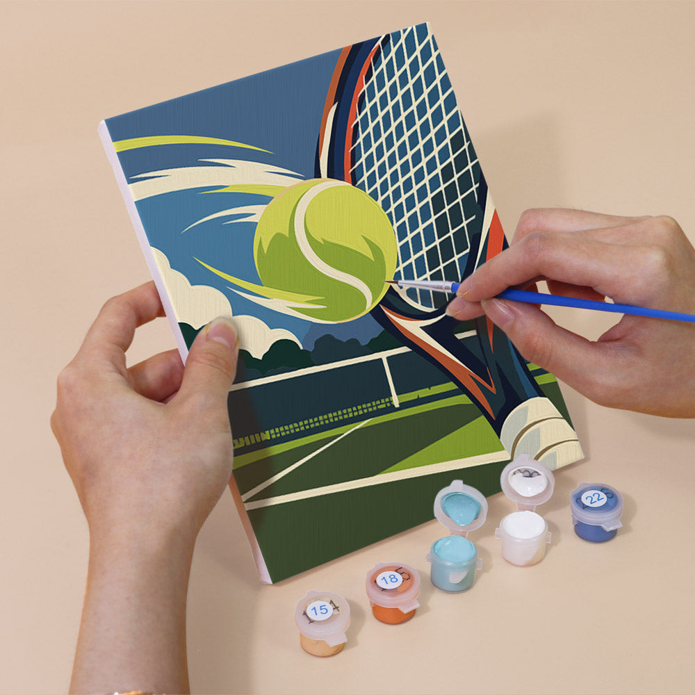 Hand holding a Game On mini canvas while painting the details