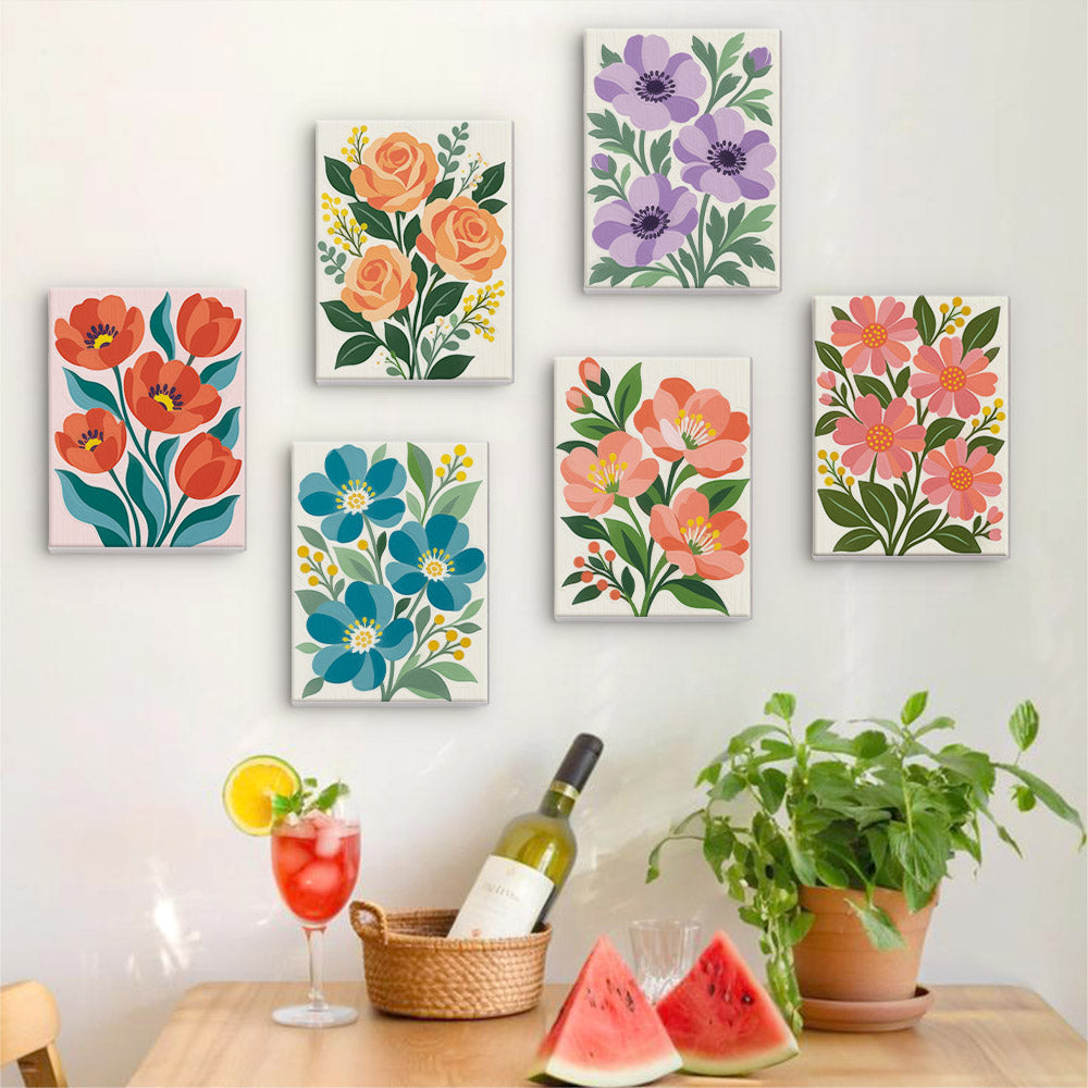 Six finished Garden Bouquets mini paintings hung on a wall above a table
