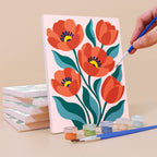 Painting a Garden Bouquets mini canvas propped up beside numbered acrylic paints
