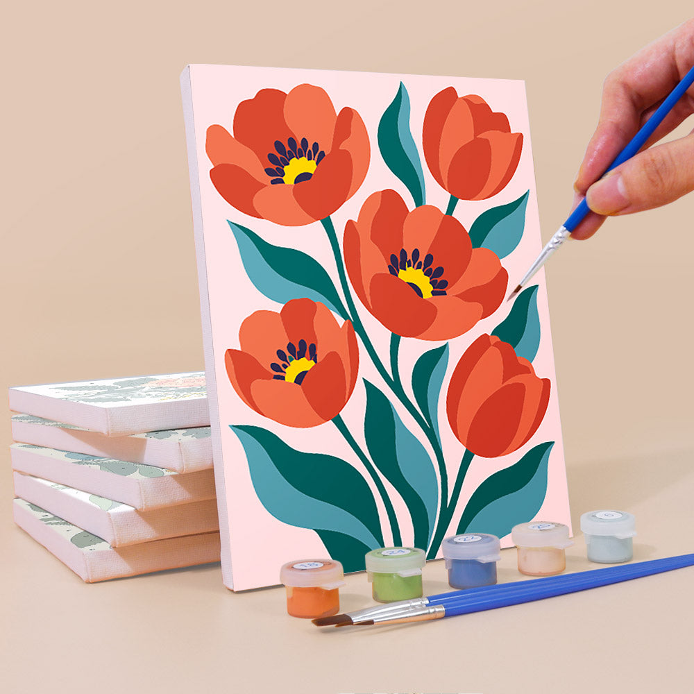 Painting a Garden Bouquets mini canvas propped up beside numbered acrylic paints