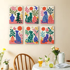 Garden Cats mini paintings displayed as a gallery wall in a sunny kitchen