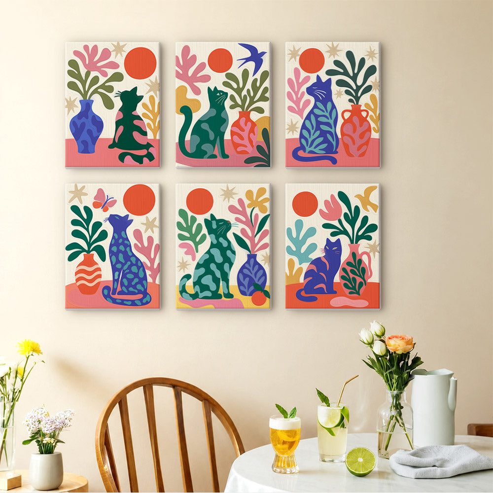 Garden Cats mini paintings displayed as a gallery wall in a sunny kitchen