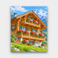Geranium Chalet paint by numbers kit of a wooden mountain chalet with balconies full of red and pink geraniums below a snowy peak