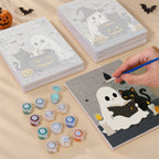 Painting one of the Ghostly Cauldrons designs next to a stack of mini canvases